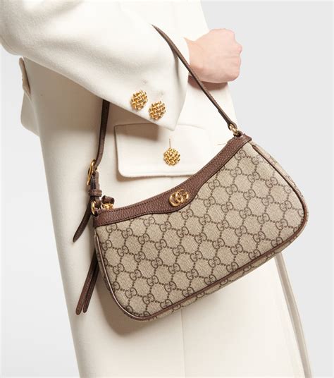 beige gucci pouch|gucci ophidia gg small bag.